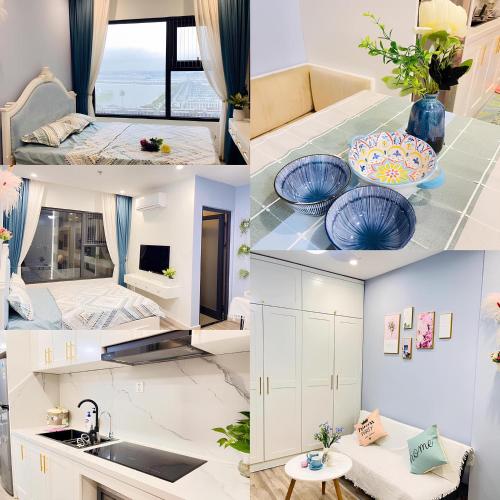 a kitchen with white cabinets and blue plates on the counter at Homestay Vinhome Ocean Park - Pearl house S108 in Hanoi