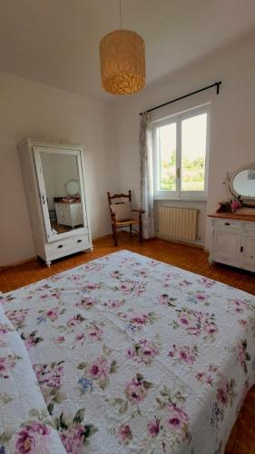 a bedroom with a large bed and a mirror at AAUT IL NOCE LEIVI codice CITRA 010029-LT-0025 in Leivi