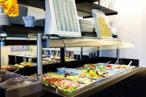 a buffet line with many different types of food at Das Edlinger in Salzburg