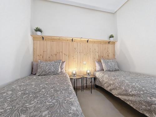two beds sitting next to each other in a room at La Serena Apartment - 3410 in Los Alcázares