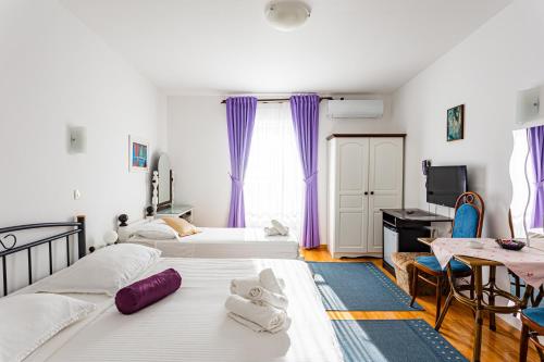 Postel nebo postele na pokoji v ubytování Villa Amigo