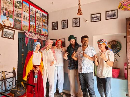 a group of people posing for a picture in a room at Little Prince Home Stay in Jaisalmer