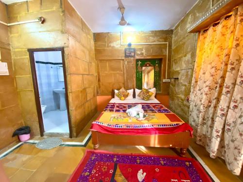 a bedroom with a bed in a room with a shower at Hostel Little Prince Home Stay in Jaisalmer