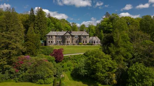 an aerial view of a large house surrounded by trees at Merewood Country House Hotel in Windermere