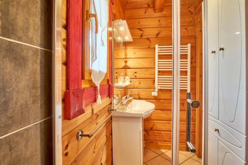 a bathroom with a sink and a mirror at Chalet le Serac in Gresse-en-Vercors