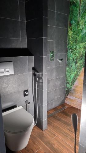 a bathroom with a toilet and a shower at Domek ASPEN in Wetlina