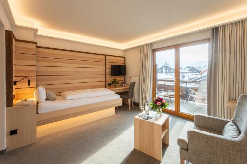 Postel nebo postele na pokoji v ubytování Hotel Filser