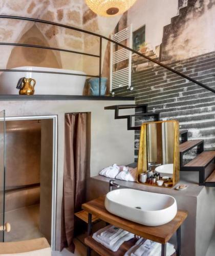 a bathroom with a sink and a mirror at Palazzo Sant'Anna Lecce in Lecce