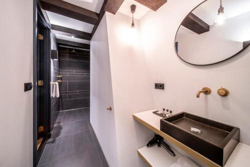a bathroom with a sink and a shower at CTY Books in Leiden