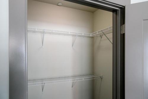 a shower with a glass door in a bathroom at Burlington 2br w gym wd nr dining shops BOS-977 in Burlington