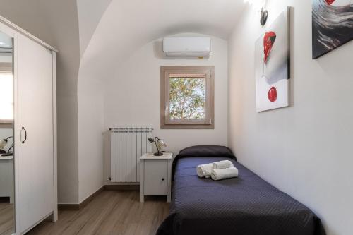 Postel nebo postele na pokoji v ubytování Casa vacanza Sotto La Lizza