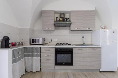 Kuchyň nebo kuchyňský kout v ubytování Casa vacanza Sotto La Lizza
