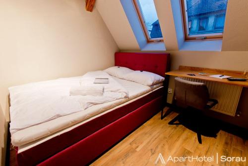 Postel nebo postele na pokoji v ubytování ApartHotel I SORAU