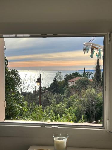 a window with a view of the ocean at Exceptionnel studio vue mer refait à neuf in Rayol-Canadel-sur-Mer