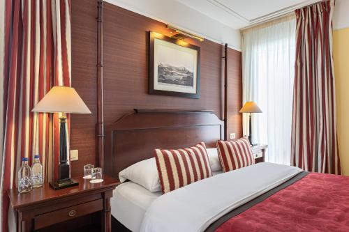 Ein Bett oder Betten in einem Zimmer der Unterkunft Kipling Manotel