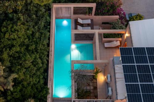 an overhead view of a swimming pool next to a building at Unlimited Blue in Chania