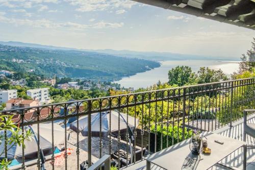 a balcony with a view of a river at Villa Izzi Opatija in Opatija