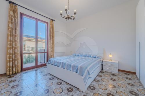 A bed or beds in a room at Il Gabbiano Nuovo a Marina di Campo - Goelba