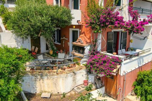 an aerial view of a building with flowers at Athena's Veranda magestic views Home 97 in Glyfada of Corfu by New Era in Glyfada