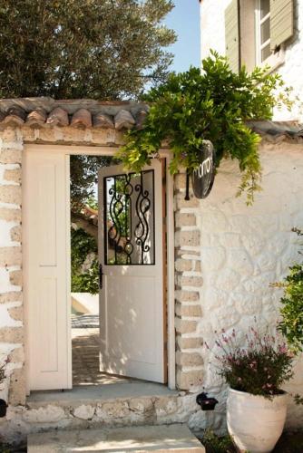 a door to a house with a sign on it at Morro Alacati in Alacati