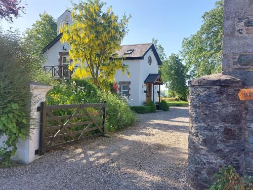 a gate in front of a white house at Bellfry at Old Boley in Wexford