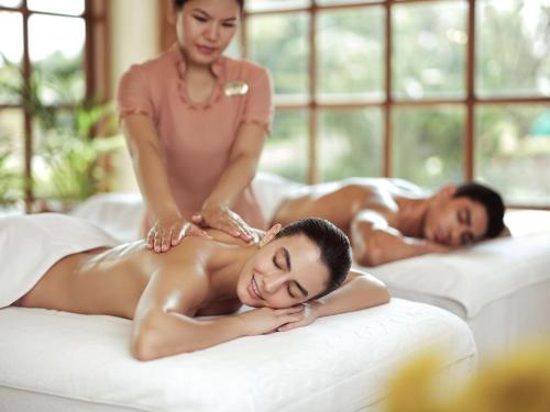 two women getting a massage at a spa at Taj Krishna in Hyderabad