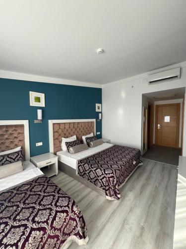 Ένα ή περισσότερα κρεβάτια σε δωμάτιο στο SL La Perla Hotel Kemer