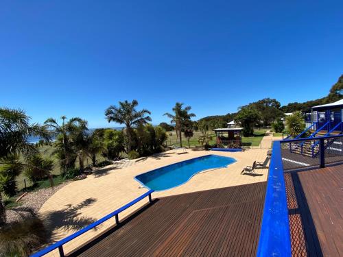 a view of a swimming pool on a deck at Doyles on the Bay in Kingscote
