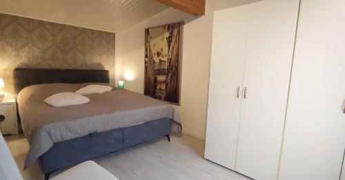 a bedroom with a bed with two pillows at Ferienhaus Leoni in Rieden
