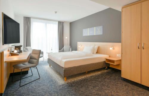 เตียงในห้องที่ Best Western Plus Hotel Papenburg