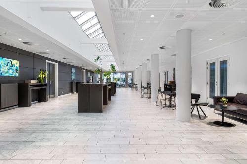 an office with a lobby with tables and chairs at Best Western Plus Park Globetrotter Copenhagen Airport in Copenhagen