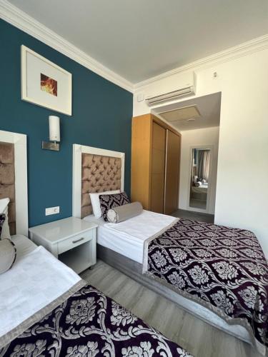 Ένα ή περισσότερα κρεβάτια σε δωμάτιο στο SL La Perla Hotel Kemer