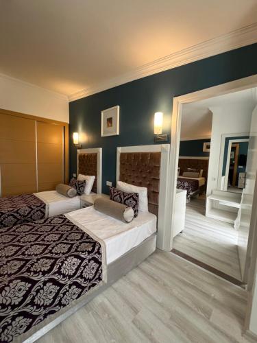 Ένα ή περισσότερα κρεβάτια σε δωμάτιο στο SL La Perla Hotel Kemer