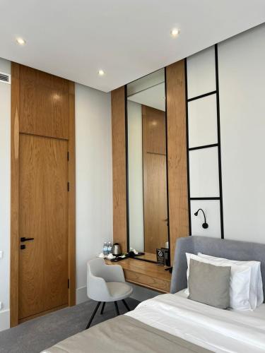 Postel nebo postele na pokoji v ubytování NEOS HOTEL