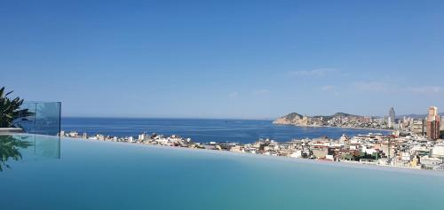 a view of the ocean from a balcony of a building at Hotel Primavera Park in Benidorm
