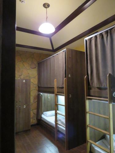 a room with two bunk beds and a light at Hostel Jan in the very center in Yerevan