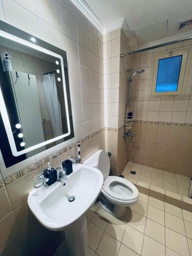 a bathroom with a sink and a toilet at lovely one bedroom self entry in Jeddah