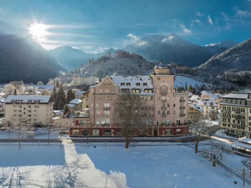 a city in the snow with mountains in the background at Apartment Modern by Interhome in Interlaken