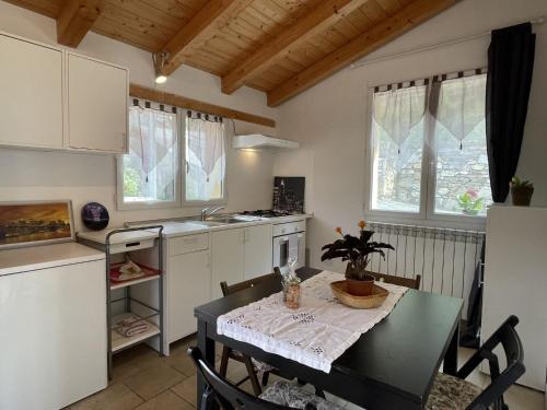 a kitchen with a table and a dining room at Apartment Adriana - PRE170 by Interhome in Valloria