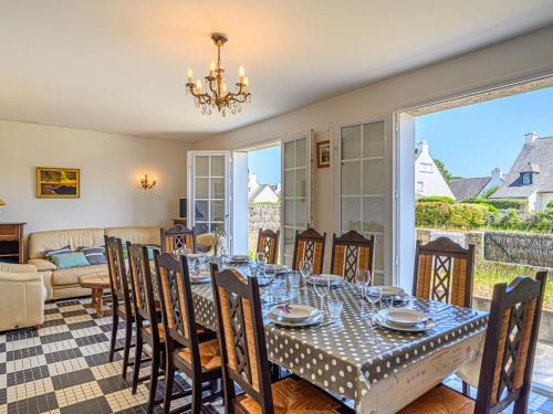 a dining room with a table and chairs at Holiday Home Pen-er-Park by Interhome in Carnac