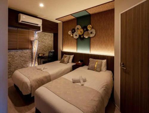 Ένα ή περισσότερα κρεβάτια σε δωμάτιο στο Branchera Naha Akebono Premist R67