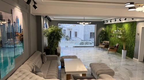 a living room with a couch and a table at Gumbaz Luxury hotel in Bukhara