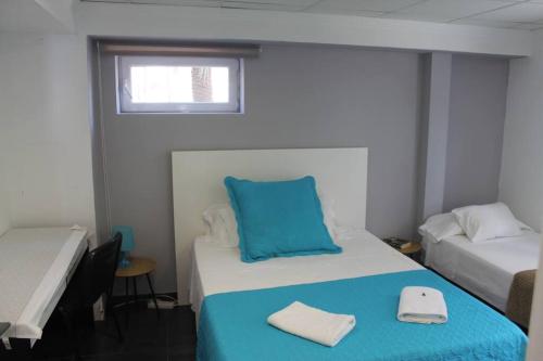 a room with two beds with blue and white at Serenity by levante beach (YAGO), 7pax wi-fi A\C in Benidorm
