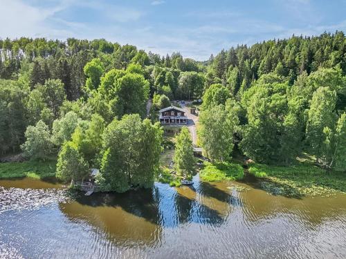 an aerial view of a house in the middle of a river at Holiday Home Hiidenlumo by Interhome in Vihti