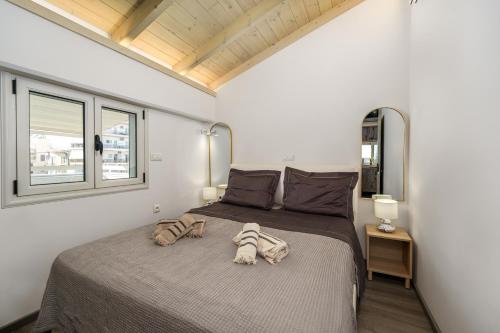 a bedroom with a large bed in a room at El Cielo Where Luxury meets the sky in Kalamata