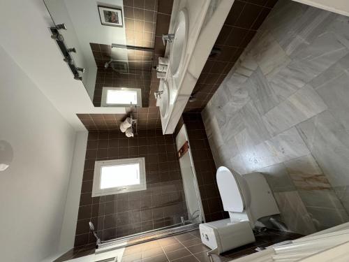 a bathroom with a staircase with a toilet at 59 Beautiful Mijas Playa Club in La Cala de Mijas