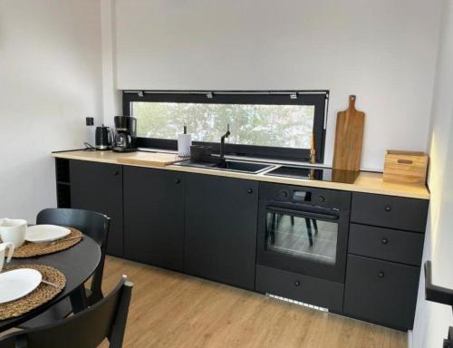 Kuchyňa alebo kuchynka v ubytovaní KASZUBSKI LOFT Sominy