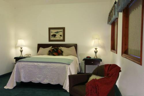 Krevet ili kreveti u jedinici u okviru objekta Greenwood Village Inn & Suites