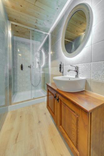 a bathroom with a sink and a shower at Casa Marie, Stay in a Traditional Corner Townhouse in the 3 cities, built in 1881 in Cospicua