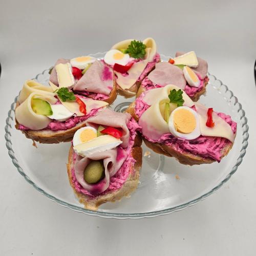 a glass plate with four pastries on it at Kavárna a penzion REICHL in Králíky